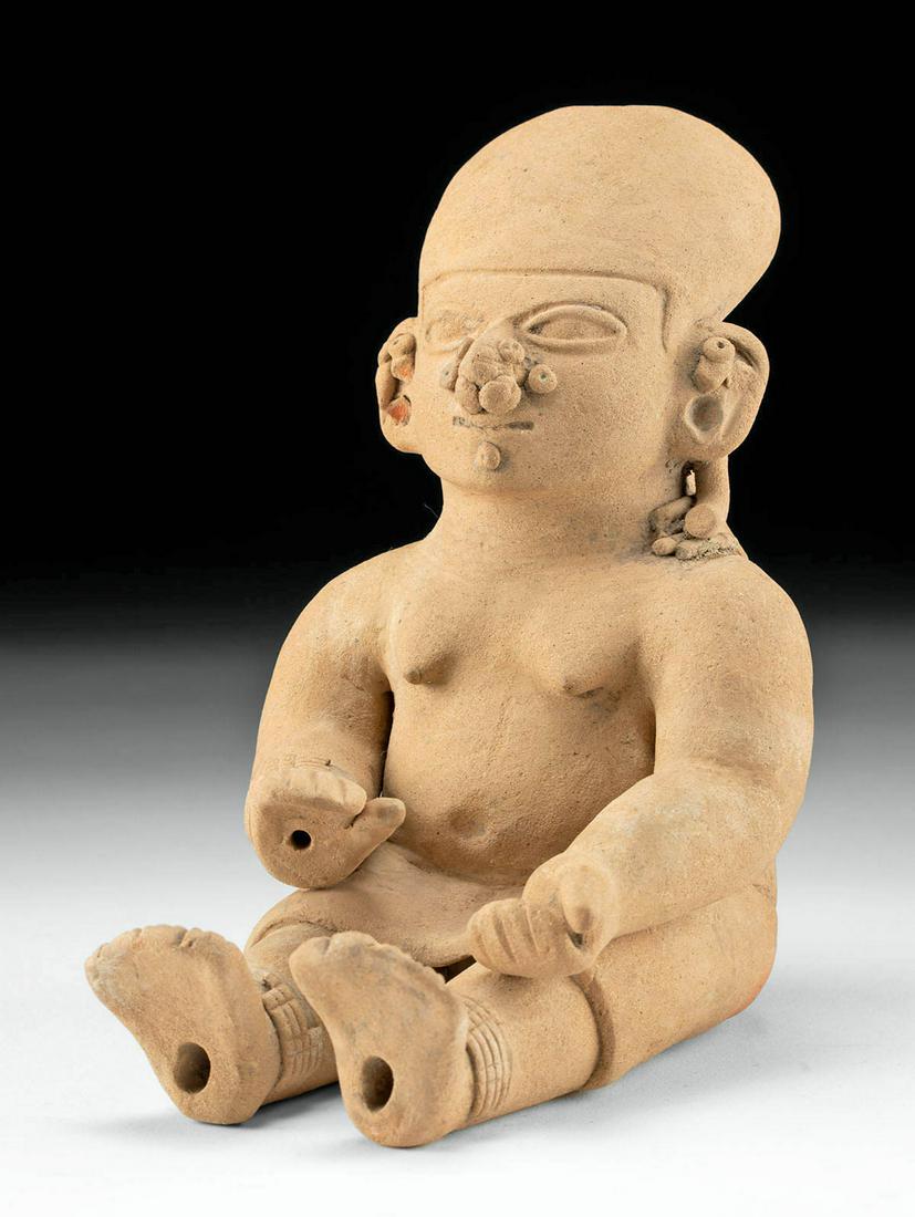 La Tolita Seated Nude Female Figure: **Originally Listed At $500** Pre-Columbian, Ecuador, La Tolita (Tumaco) culture, ca. 600 BCE to 200 CE. An impressive pottery figure of a female shown bare-chested with bangles, anklets, necklaces, a