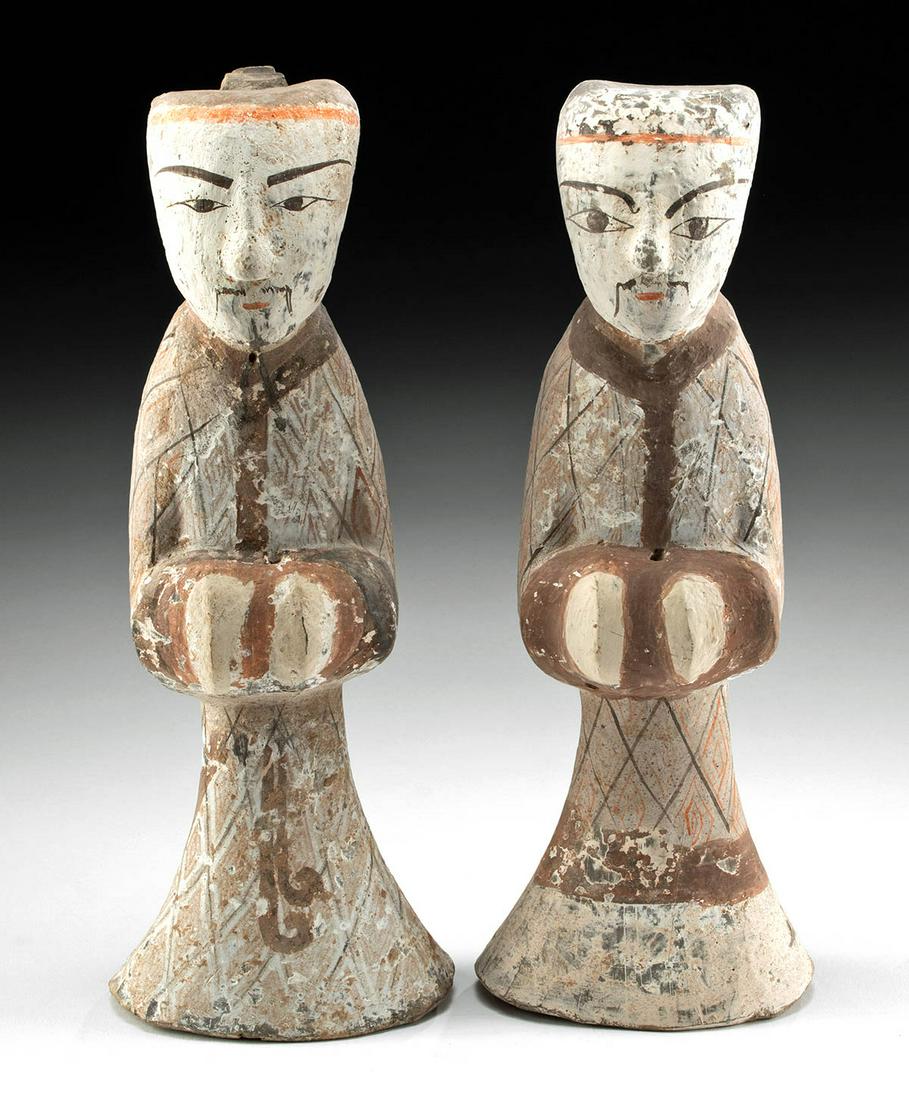 Chinese Han Dynasty Male Attendants - TL Tested: East Asia, China, Han Dynasty, ca. 206 BCE to 220 CE. A fine pair of pottery male figures, both shown standing with hands together at waist and displaying slender bodies draped in lengthy, flared robe