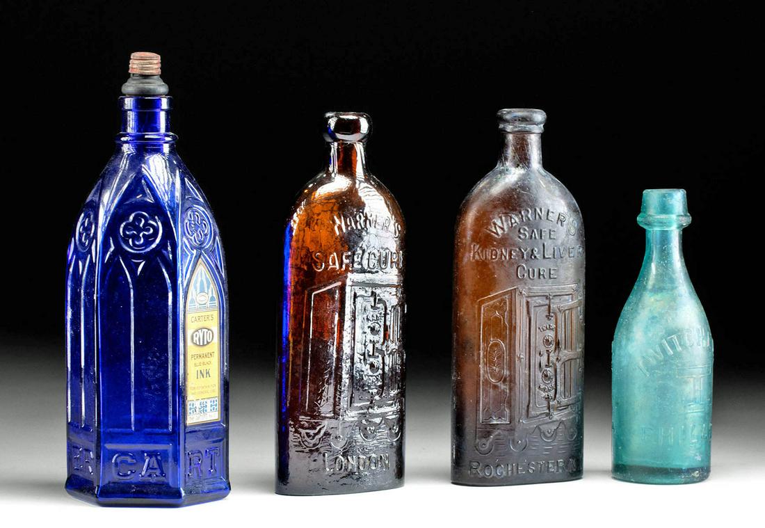 19th C. US Glass Bottles - Carter's Ink & Warner's (4): **Originally Listed At $300** North America, United States, ca. late 19th to early 20th century CE. A fine collection of 4 glass bottles in cobalt, dark brown, amber, and aqua hues. The largest is the