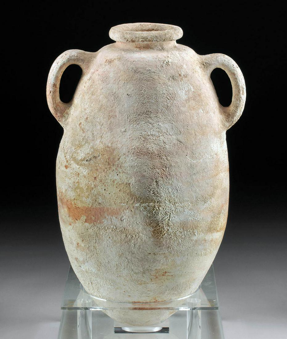 Ancient Phoenician Pottery Transport Amphora: **First Time At Auction** Ancient Near East, Phoenicia, ca. 8th to 5th century BCE. A sizable and splendid wheel-thrown pottery transport amphora with a wide hemispherical base, a tapering body, a rou