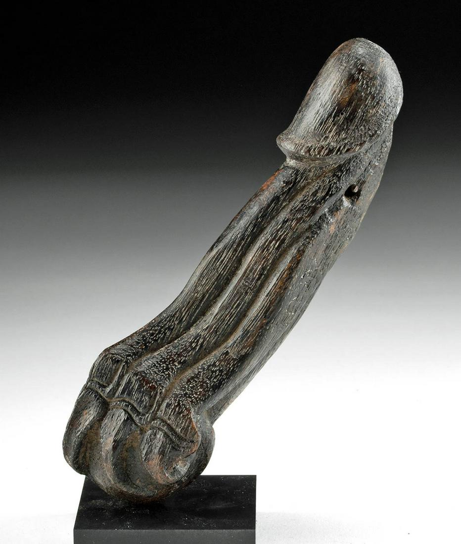 19th C. Indonesian Amulet Phallus Emerging from Claw: **First Time At Auction** Southeast Asia, Indonesia, Borneo, Kalimantan culture, ca. 19th century CE. A skillfully carved wood amulet in the form of a phallus emerging from the claw of a feline. A pow