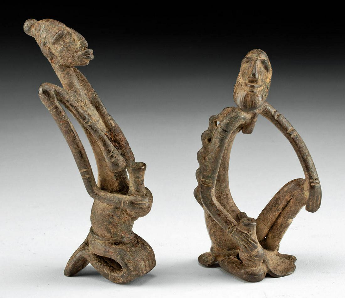 19th C. African Dogon Brass Figures Man & Woman: **First Time At Auction** West Africa, Mali, Dogon culture, ca. late 19th to mid- 20th century CE. A pair of cast brass figures of a man and woman, in a seated position and holding beverage cups in th