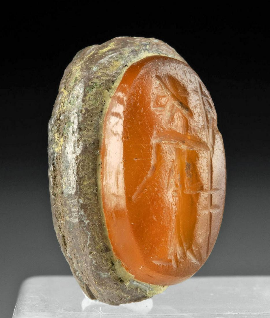 1st C. Roman Citrine Intaglio of Jupiter Silver Bezel: Roman, Imperial Period, ca. 1st to 3rd century CE. An ovoid bezel formed from 94.99% silver with a hand-carved citrine intaglio set within. Framed within the beveled edge and incised atop the intaglio