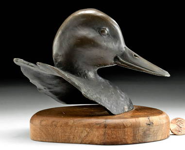 American Bronze Duck on Wood Base by John Scott: North America, United States, 20th century. A bronze bust of a Mallard Duck mounted on a hand-carved wooden base by American artist John J. Scott (American, 1919-2016). Skillfully cast via the lost