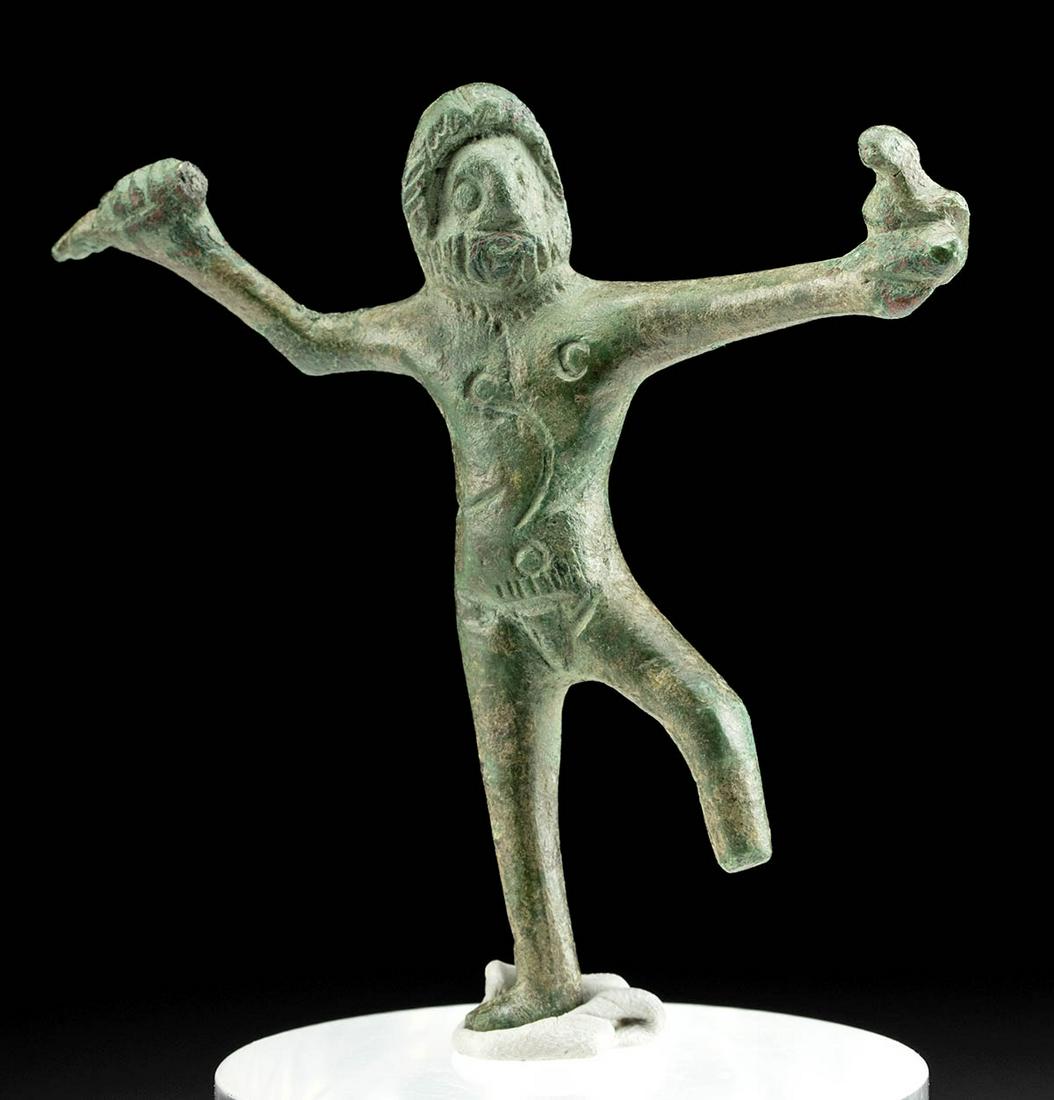 Etruscan Bronze Figure - Nude Zeus: Northern Italy, Etruria, Etruscan people, ca. 6th to early 5th century BCE. A lovely leaded bronze figurine of Zeus (Roman Jupiter), the supreme god in Greek mythology, depicted nude and striding forw