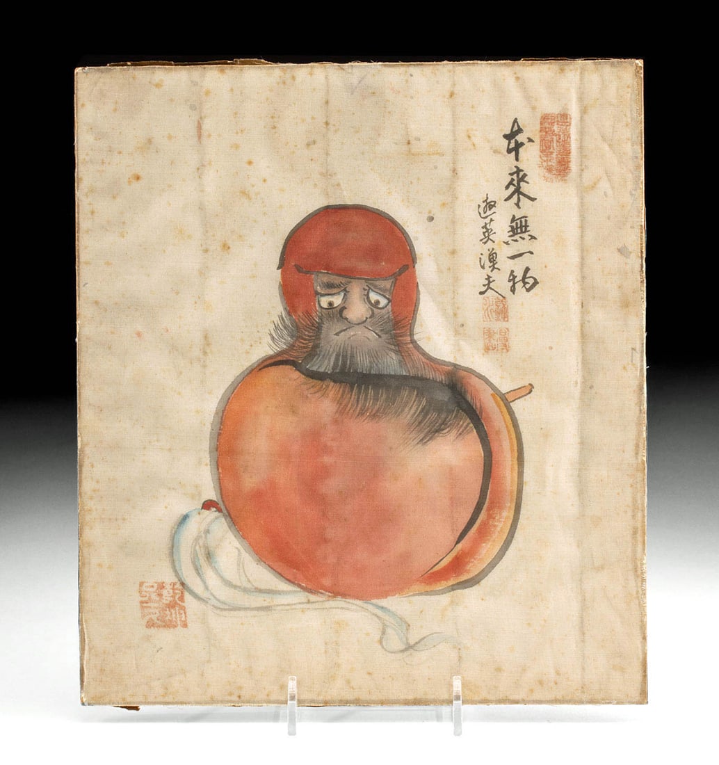 19th C. Japanese Meiji Silk Painting of Daruma Monk: East Asia, Japan, Meiji era, ca. 19th to early 20th century CE. A silk painting of a Daruma monk (Bodhidharma) wrapped in red robes marked with calligraphy, artist signature, and red seal marks, and t
