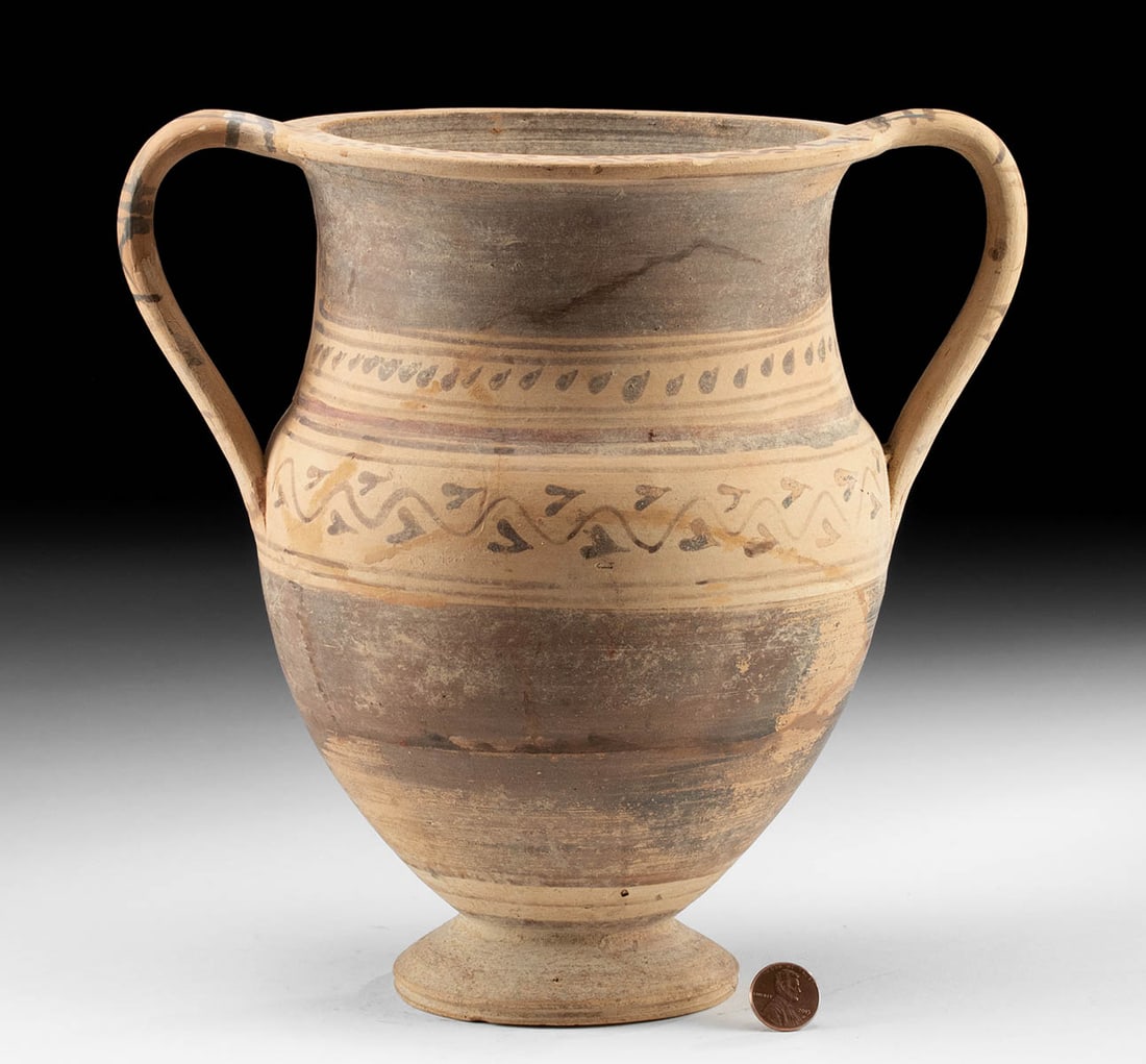 Greek Daunian Amphora w/ Ivy Vines, Leaves: Magna Graecia, South Italic, Daunian, ca. 300 BCE. A wheel-thrown pottery amphora decorated with bands of painted ivy and ivy leaves along the midsection of the inverted piriform body as well as atop 