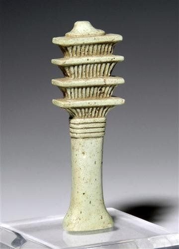 An Egyptian Faience Djed Pillar Amulet: Dating to Egypt's Third Intermediate Period, approximately 1070-712 B.C. Of typical simple form with pale blue glaze, with exquisite and crisp detailing. The djed pillar amulet was one of the most com