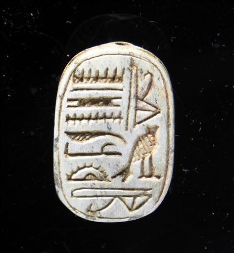 An Egyptian Steatite Scarab - New Kingdom: Egypt, Dynasties 18 thru 20, ca. 1550 to 1069 BC. Carved steatite with multiple glyphs – not yet translated. Fine beetle on obverse. 28mm x 19mm. Provenance: Ex-private East Coast USA collection.