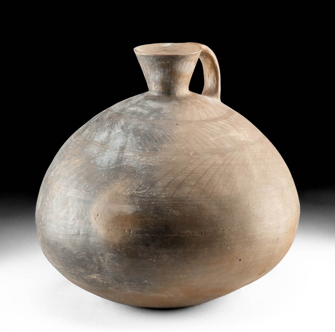 Large Amlash Pottery Jug w/ Linear Design, TL Tested: Ancient Near East, Northwestern Iran, Amlash, ca. late 2nd to early 1st millennium BCE. A sizable example of a hand-built pottery pitcher, its surfaces covered in burnishing marks as well as decorated