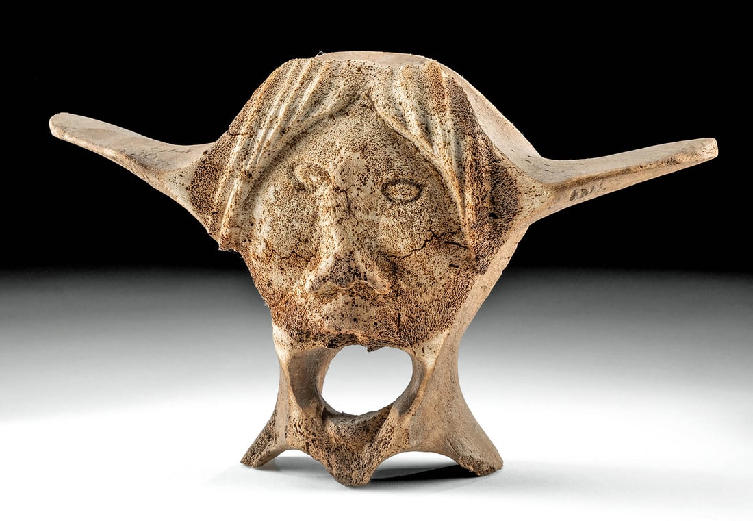 Inuit / Inupiat Whale Bone Vertebra Sculpture: Native American, Northwestern United States, Alaska or Canada, Inuit or Inupiat people, ca. mid to late 20th century CE. A carving of a face using a single large whale vertebra bone, the foramen (open