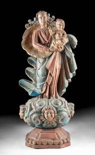 Spanish Colonial Polychrome Wood Madonna & Child Statue: Americas or Philippines, Spanish Colonial era, ca. 19th century CE. A large and very fine carved wooden santos of Madonna and Christ child standing on a celestial cloud pedestal with a cherub heads. T