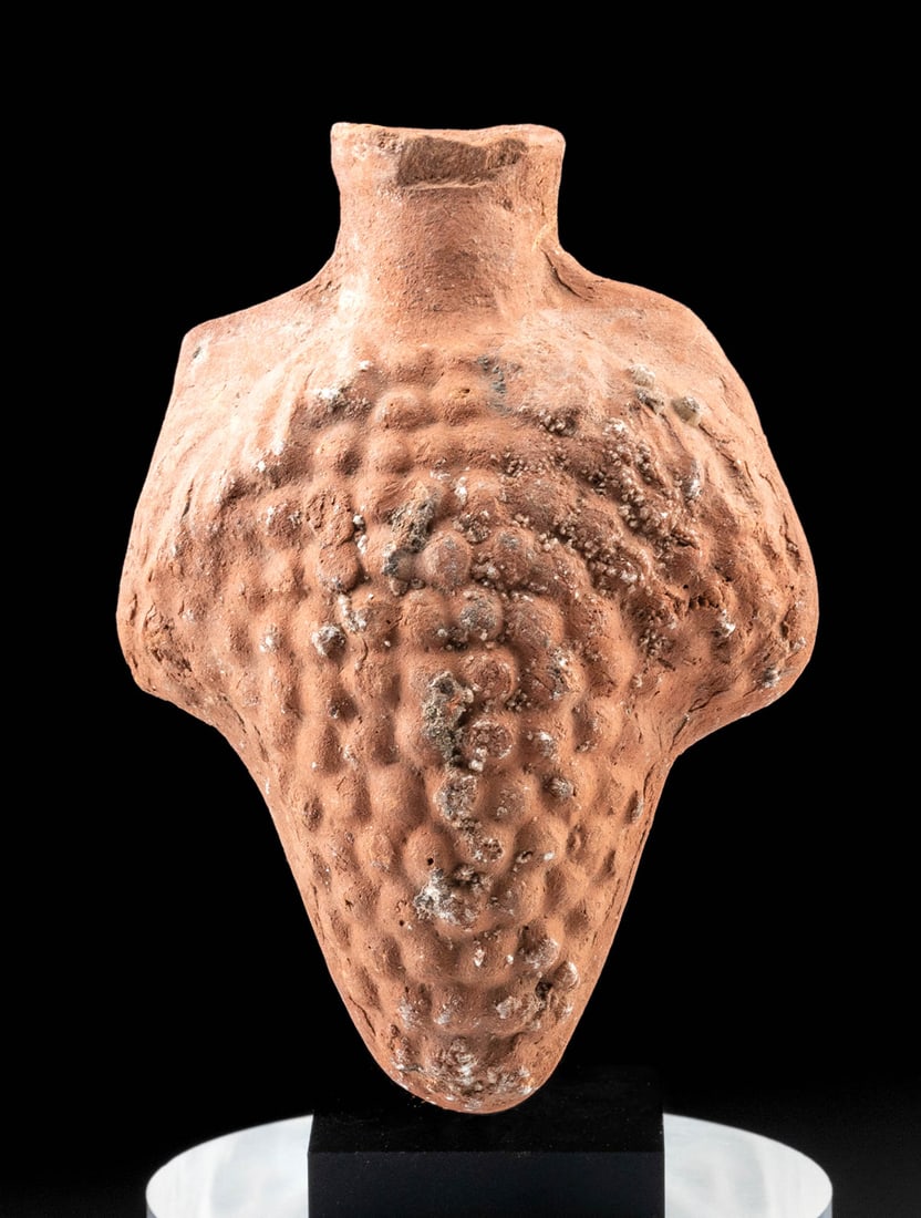 Romano-Egyptian Pottery Grape Vessel, ex-Lily Place: Egypt, Romano-Egyptian Period, ca. 30 BCE to 2nd century CE. A delightful, mold-made pottery flask in the form of a cluster of grapes flanked by a pair of broad leaves and surmounted by a flared spout