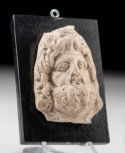 Published Romano-Egyptian Serapis Head, ex-Lily Place: Ancient Egypt, Ptolemaic to Romano-Egyptian Period, ca. 2nd century BCE to 2nd century CE. A hand-built plaster head of Serapis, god of fertility and the afterlife, a Graeco-Egyptian god who first