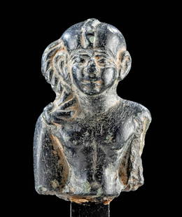 Published Egyptian Serpentine Harpocrates, ex-LACMA: Ancient Egypt, Late Dynastic to Ptolemaic Period, ca. 664 to 30 BCE. A rare and slender black serpentine carving of Harpocrates (literally "Horus the Child"), the god of silence and secrets. The