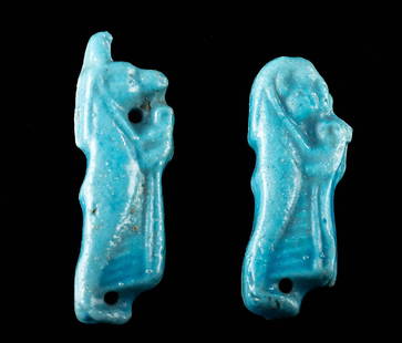 Egyptian Faience Sons of Horus Amulets, ex MIA: Ancient Egypt, Late Dynastic to Ptolemaic Period, ca. 664 to 30 BCE. A pair of faience amulets depicting 2 of the 4 Sons of Horus, each holding a length of linen for the dead. The jackal-headed figure