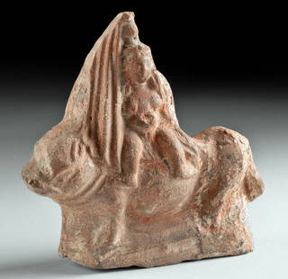 Romano-Egyptian Figural of Nude Baubo: Egyptian, Roman Period, ca. 1st century CE. A lively terracotta sculptural rendering of Baubo, goddess of ribald jocularity. She is nude, legs spread, a vase atop her head with a long veil hanging