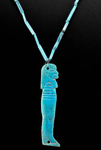 Egyptian Faience Bead Necklace w/ Imsety Pendant: Ancient Egypt, Third Intermediate to Ptolemaic Period, ca. 1070 to 30 BCE. A wearable necklace strung with dozens of tubular faience beads covered in lustrous blue glaze. Dangling from the center is a