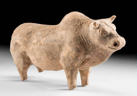 Chinese Han Dynasty Pottery Figure of a Bull: East Asia, China, Han Dynasty, ca. 206 BCE to 220 CE. A hollow-molded pottery figure of a bull standing atop delineated legs. The muscular bovine presents its large head, horns, and hump in a majestic