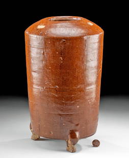 Chinese Tang Dynasty Glazed Pottery Granary Jar: China, Tang Dynasty, ca. 618 to 907 CE. Tall pottery model of a granary jar designed to be placed in a tomb to assure plentiful food in the afterlife. Glazed in thick orange/brown slip that was applie