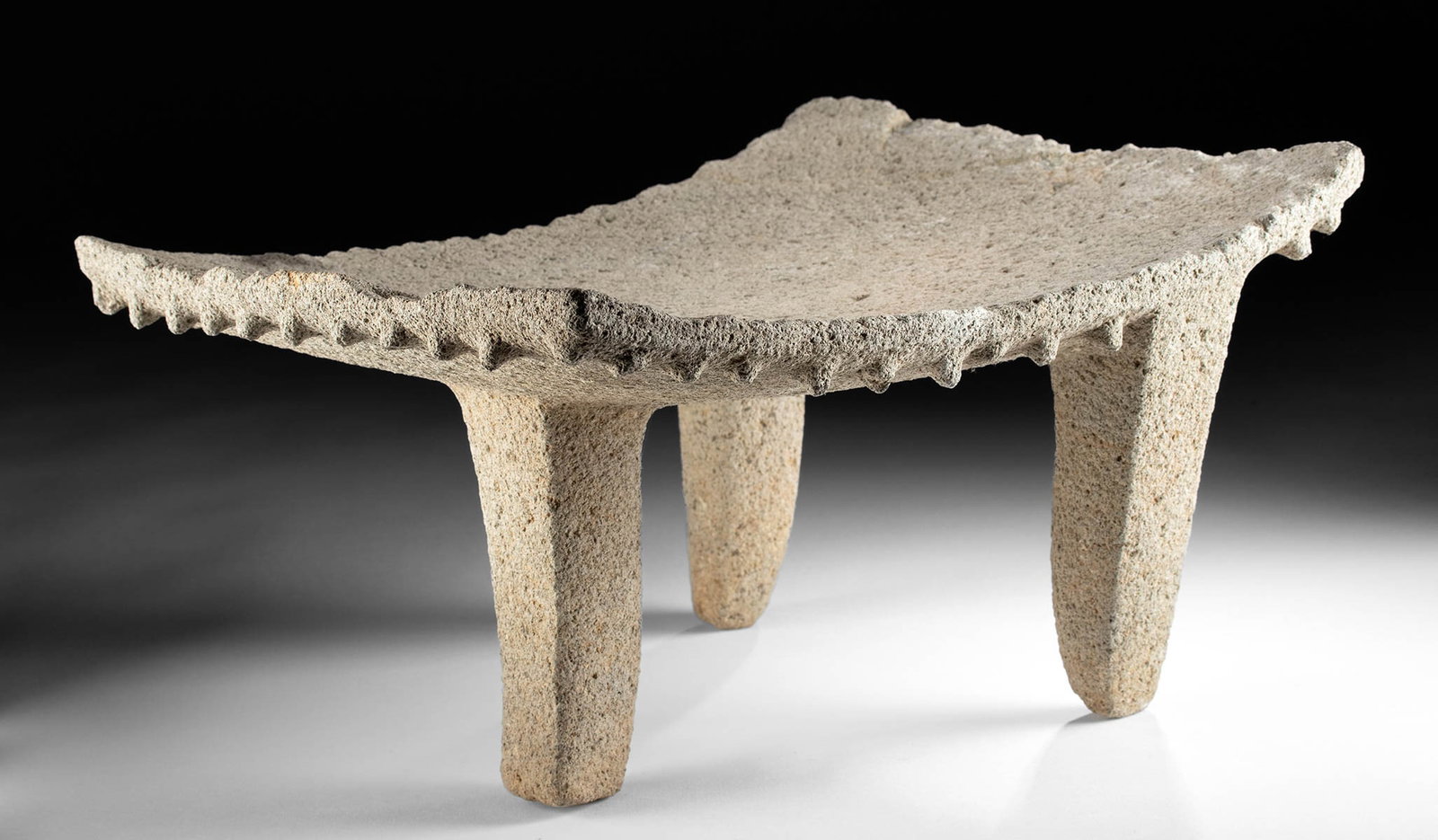 Costa Rican Volcanic Stone Tripod Metate, ex-Stendahl: **Originally Listed At $1000** Pre-Columbian, Costa Rica, Atlantic Watershed, ca. 800 to 1200 CE. Hand-carved from a single piece of grey volcanic stone, this is a large ceremonial metate. The edges a