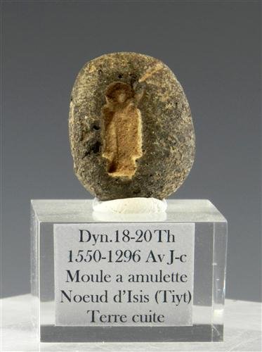 An Egyptian Terracotta Isis Knot: Egypt, Dynasties 18-20, 1550-1296 BC. Egyptian amulet mould of “Tiyt“ Isis Knot made from terracotta nile clay; deep-cut detail, some nicks to edges. Remains of faience paste inside. 7/8" x 7'8".