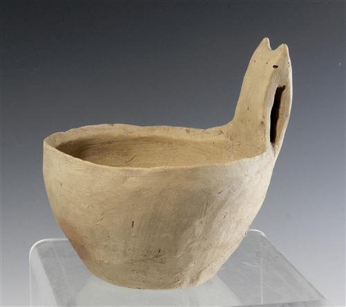 An Early Daunian Terracotta Kyathos - Published: South Italic, ca. 400 BC. A very early… and published… hand-formed pottery single handled drinking cup. 4-1/2"D x 4-1/2"H. Part of a 209 piece collection of ancient pottery featured in the book, "