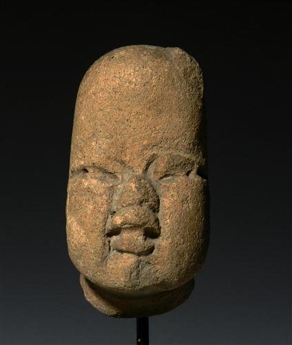 A Fine Olmec Pottery Head: Pre-Columbian, Western Mexico, Ca 1000 to 500 BC. Very classic Olmec Baby-like face with chubby cheeks, full pouty lips and drilled eyes, small lock of hair to his left side of his head else bald. Cus
