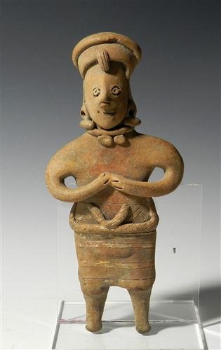 A Pre-Columbian Colima Flat Figure: From ancient Mexico, Colima, Ca. 200 BC – 200 AD. Terracotta flat figure of a male? wearing a head dress, earrings, a necklace, loin cloth? and features incised detailing. 8"T. Provenance: Ex-Fort K