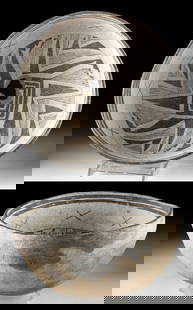 Prehistoric Mimbres Black on White Bowl Kill Hole: Native American, Southwestern United States, New Mexico, Mimbres Valley, Mimbres, ca. 1025 to 1250 CE. An attractive pottery bowl of hemispherical form with a deep interior basin adorned with