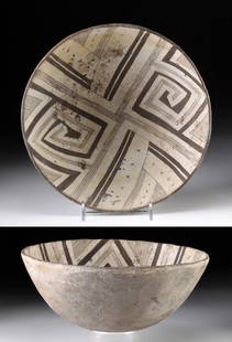 Mimbres Black on White Pottery Bowl: Native American, Southwest, New Mexico, Mimbres Valley, ca. 950 to 1300 CE. An attractive pottery bowl displaying a hemispherical form created via the coil and scrape technique. Adorned in black-on-wh