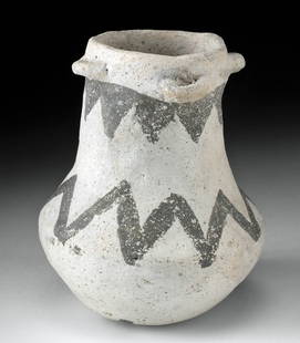 Prehistoric Anasazi Chaco Black on White Jar: Native American, Southwestern United States, Arizona, Anasazi (Ancestral Puebloan), Chaco style, ca. 975 to 1150 CE. A white-ground bottle with a piriform body, a carinated midsection, and a broad rim