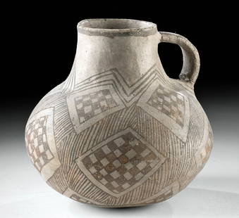 Prehistoric Anasazi Black on White Pottery Jar: Native American, Southwestern United States, Anasazi (Ancestral Puebloan), ca. 850 to 1150 CE. A white-ground pottery jar, formed via the coil-and-scrape technique, with an apple-shaped body and a