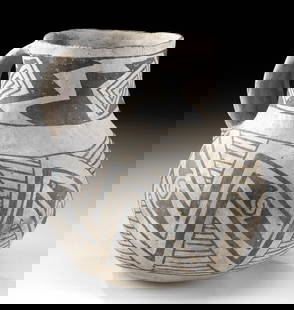 Prehistoric Anasazi Black on White Pottery Juglet: Native American, Southwestern USA, Colorado or New Mexico, Anasazi / Ancestral Puebloans, ca. 1100 to 1300 CE. A white-ground pottery jar formed via the Puebloan coil-and-scrape technique to have a