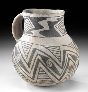 Prehistoric Anasazi Black on White Pottery Juglet: Native American, Southwestern USA, Colorado or New Mexico, Anasazi / Ancestral Puebloans, ca. 1100 to 1300 CE. A white-ground pottery jar formed via the Puebloan coil-and-scrape technique to have a