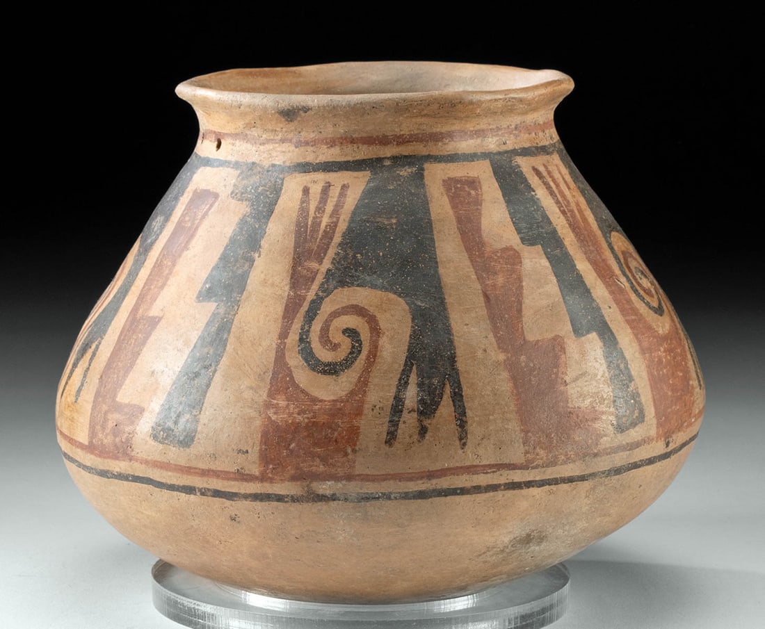 Casas Grandes Paquime Polychrome Jar: Pre-Columbian, Northern Mexico, Casas Grandes (Paquime) culture, ca. 900 to 1300 CE. A delightful pottery jar presenting a rounded base, a sloped shoulder, and an attenuated mouth with a flared rim. E