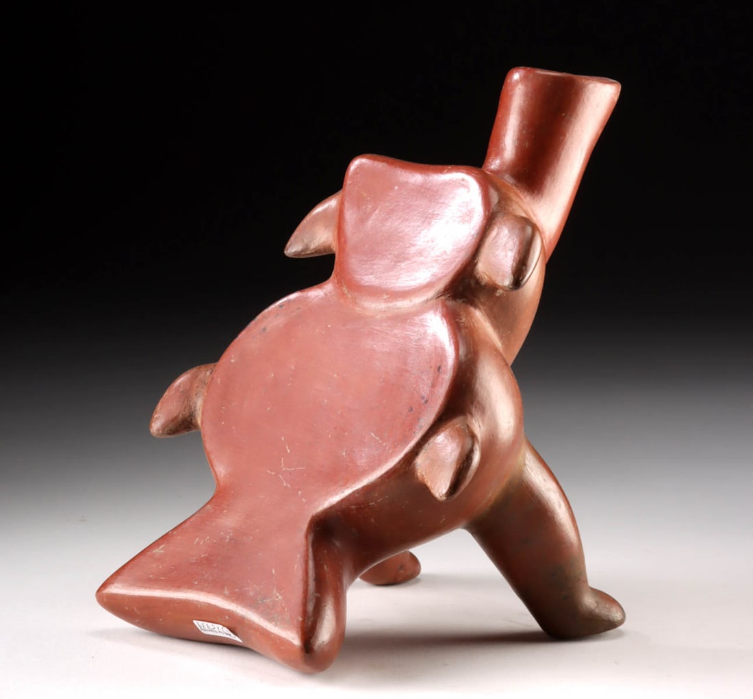 Colima Redware Reclinatorio - Abstract Creature: Pre-Columbian, West Mexico, Colima, ca. 300 BCE to 300 CE. An impressive hand-made pottery reclinatorio depicting an abstract creature, perhaps a dolphin, a fish, or a bird. The front of the vessel is