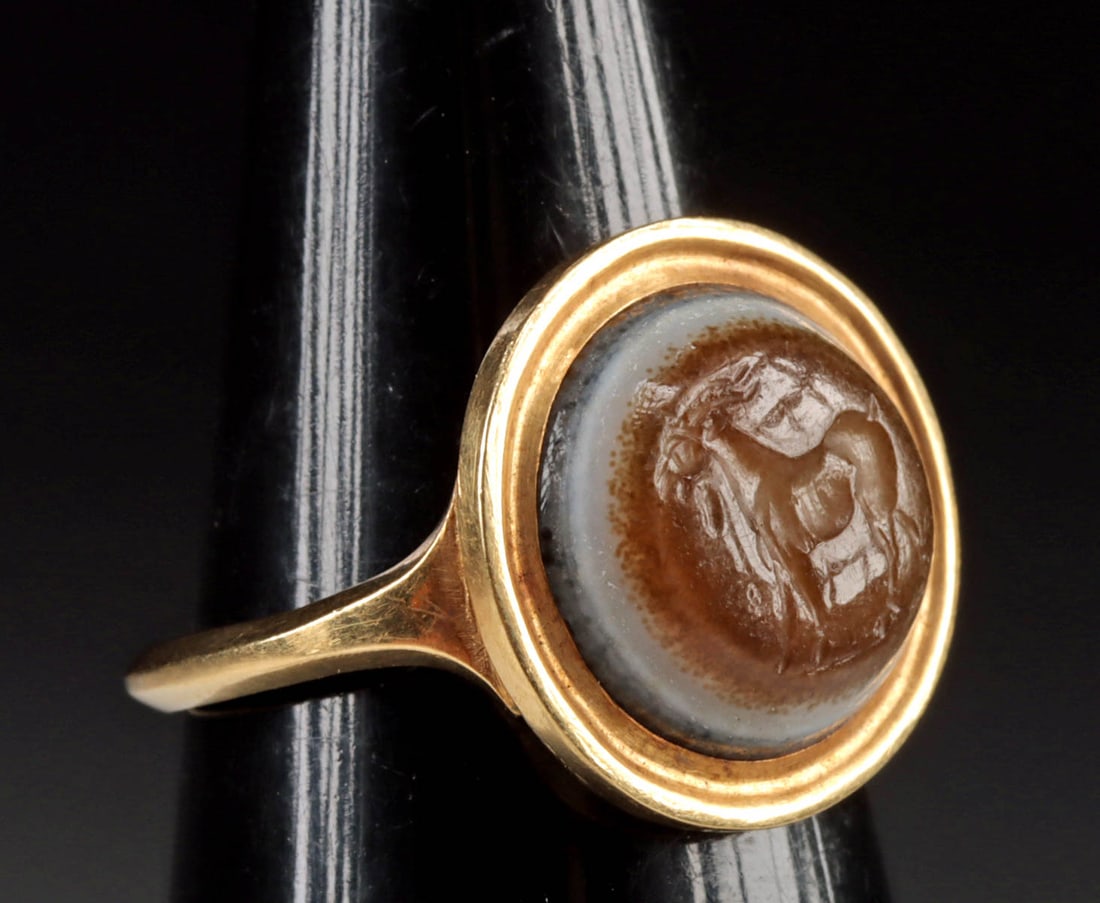 Roman Nicolo Intaglio of Goat (in Gold Ring), ex-Sotheby's: Roman, Republic Period, ca. 1st century BCE. A beautiful goat intaglio hand-carved from banded chalcedony (nicolo) and set inside the bezel of an antique 19th or early 20th century 16K+ to 21K gold ri