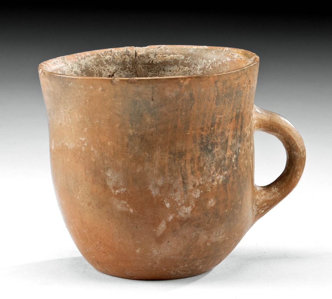Ancient Amlash Redware Mug, 1960s Collection: **Originally Listed At $200** Ancient Near East, Northwestern Iran, Amlash culture, ca. 1200 to 800 BCE. A hand-built and stone-burnished pottery mug with a planar base, tall walls, a petite rim, and