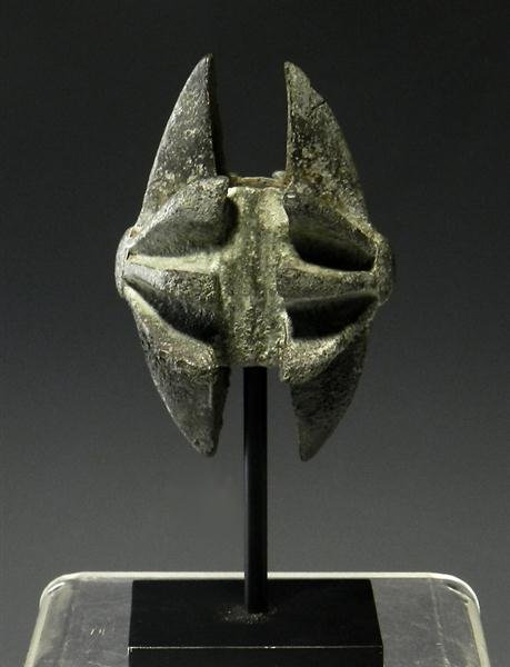A Luristan Bronze Spiked Mace Head: From the ancient Near East, Luristan, ca. 1200 - 800 BC. Mace head mounts to shaft in middle of head, and is surrounded by rows of raised bronze forming spikes. Custom museum quality stand. 3-1/2" x 2