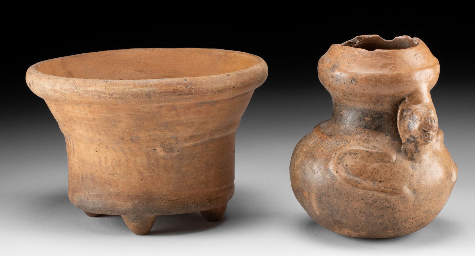 Pair of Maya Pottery Vessels - Quadruped & Monkey Jar: Pre-Columbian, southern Mexico to Guatemala, Maya, Late Classic Period, ca. 550 to 900 CE. A pair of fascinating redware vessels: a squash-form jar with the figure of a monkey on top and a quadruped d