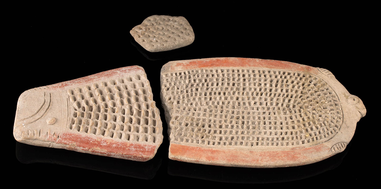 3 La Tolita Pottery Fish Grater Fragments: Pre-Columbian, Colombia, Tumaco region, La Tolita culture, ca. 500 BCE to 500 CE. A gathering of 3 fragmentary pottery fish graters with dozens if not hundreds of raised flanges intended for stripping