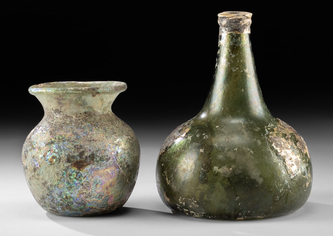 Ancient Roman Glass Jar & 17th C. European Onion Bottle: Roman, Imperial Period, ca. 1st to 3rd century CE; Western Europe or United States, ca. 18th century CE. A pair of glass vessels: one ancient Roman jar and an antique onion bottle. The Roman jar is se