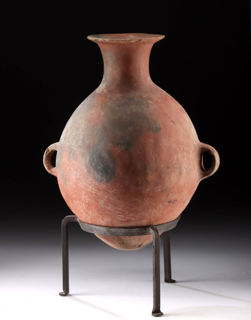 Inca Redware Pottery Aryballo: Pre-Columbian, North Coast of Peru, Inca Empire, ca. 1300 to 1500 CE. An elegant pottery aryballos featuring a voluminous body that dramatically slopes to an attenuated neck and graceful flared rim, a