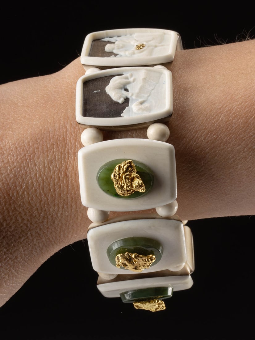 1950s Alaskan Carved Bone Bracelet - Gold Nuggets, Jade: United States, Alaska, ca. 1950's. A very desirable Native American made bracelet made from fossilized mammoth tusk, walrus ivory, jade and gold nuggets. Three carved scenes of bears, miner and moose