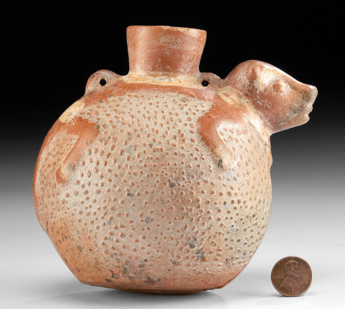 Chimu Redware Vessel - Coatimundi: **Originally Listed At $350** Pre-Columbian, Central Coast Peru, Chimu, ca. 1100 to 1470 CE. A delightful redware jar presenting a swollen body with stippled walls capped by an adorable coatimundi. Ad