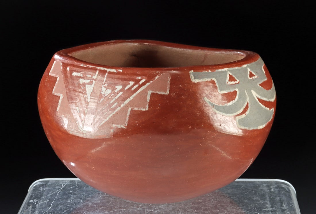 Native American Santa Clara Redware Seed Jar: Native American, Southwestern United States, Pueblo, Papago, Santa Clara, ca. mid to late 20th century CE. A pretty pottery seed jar enveloped in lustrous red pigment with matte black, white, and red
