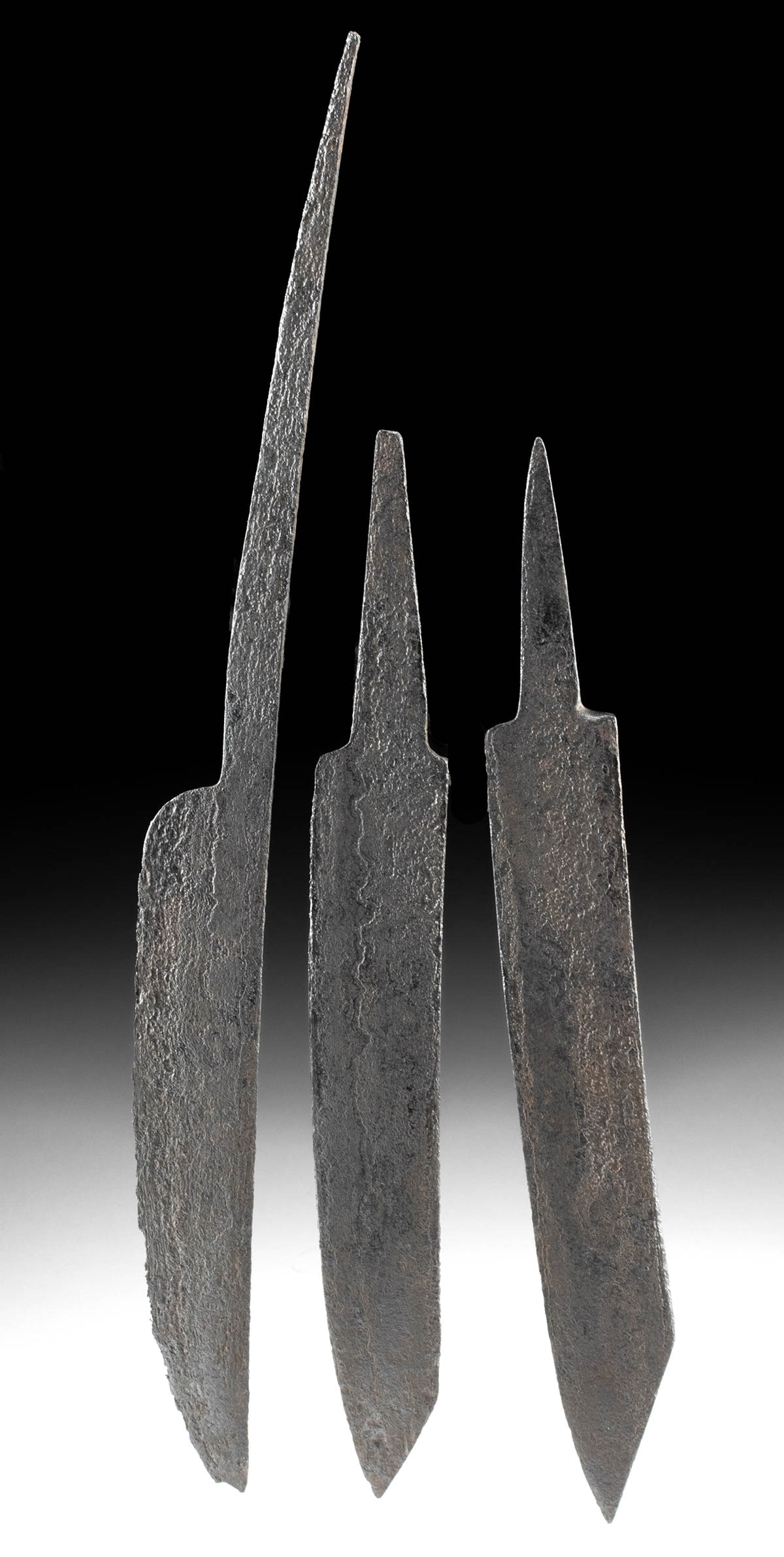Three 9th C. Viking Iron Knife Blades: Northern Europe, Scandinavia, Viking or Norse culture, ca. 9th to 11th century CE. A collection of three forged-iron knife blades from the ancient Viking people, each displaying a single-edged design 
