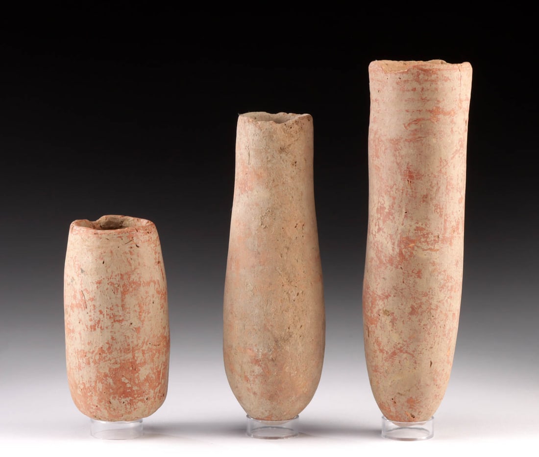 Three African Djenne Redware Cylindrical Vessels & Cup: Western Africa, Mali, Middle Niger Civilization / Djenne, ca. 19th century CE or earlier. A group of 3 redware vessels, each of slender cylindrical form. The smallest has a flat, stable base and may h