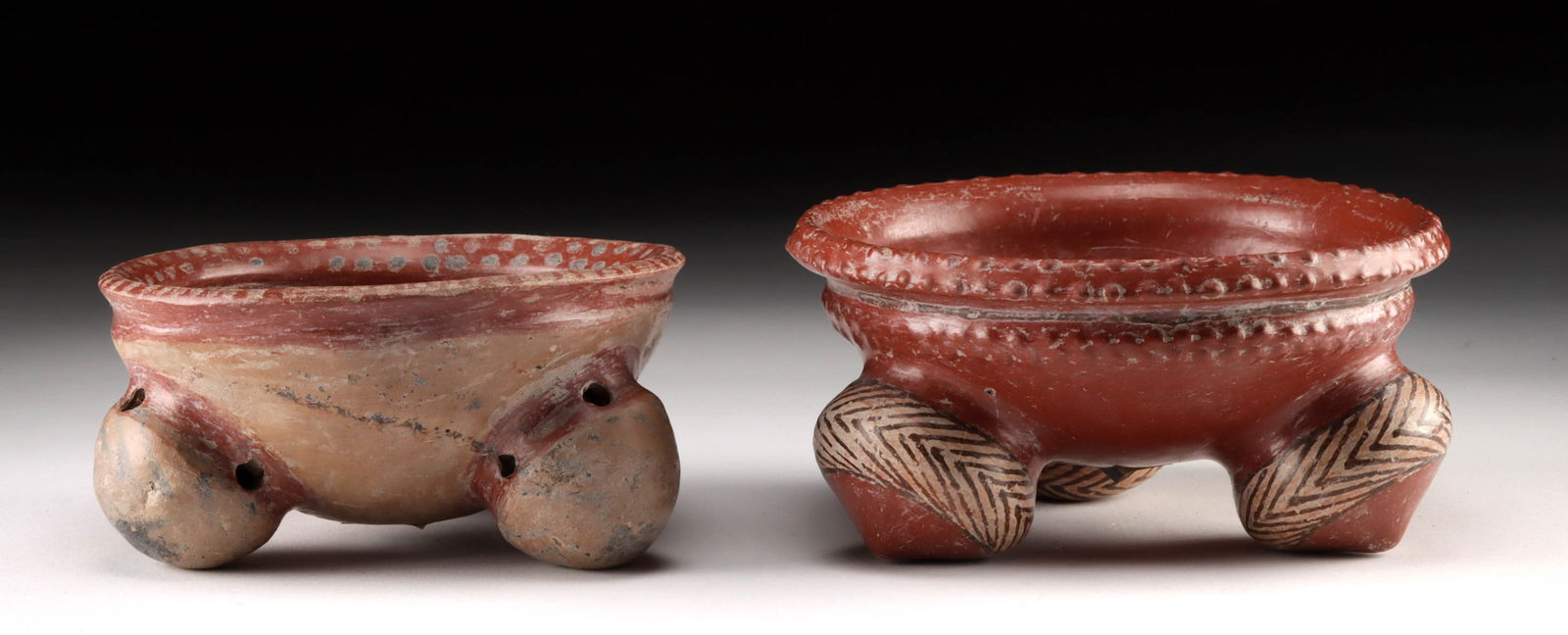 Two Chupicuaro Redware Tripod Bowls, Rattle Legs!: Pre-Columbian, West Mexico, Chupicuaro, ca. 500 to 100 BCE. A set of 2 hand-built redware pottery bowls each with a trio of hollow feet, some of which still contain their original rattle balls. The sm
